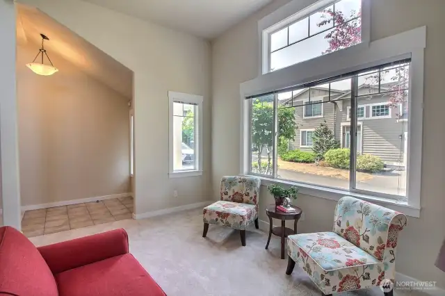 Bright formal living room has fantastic large windows and the white trim really frames them beautifully!
