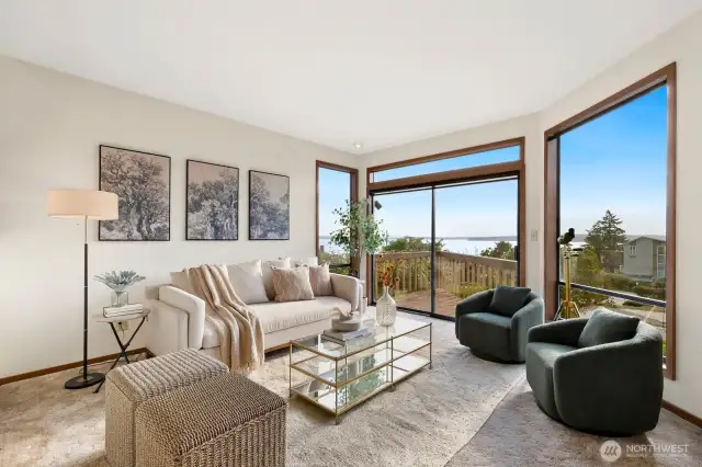 Formal dining & living facing Western Sound & Mountain Views, opening to deck