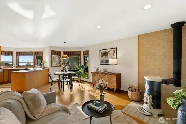 Open kitchen w/ Sound views, casual dining area & den