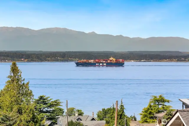 STUNNING, PANORAMIC VIEWS of Puget Sound & Olympic Mtns are the focal point of this 4 bed/4 bath Richmond Beach home.