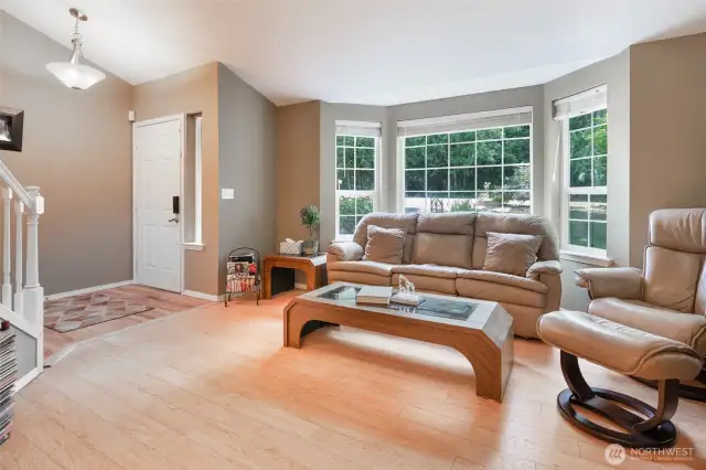 Formal living room with a bay window.