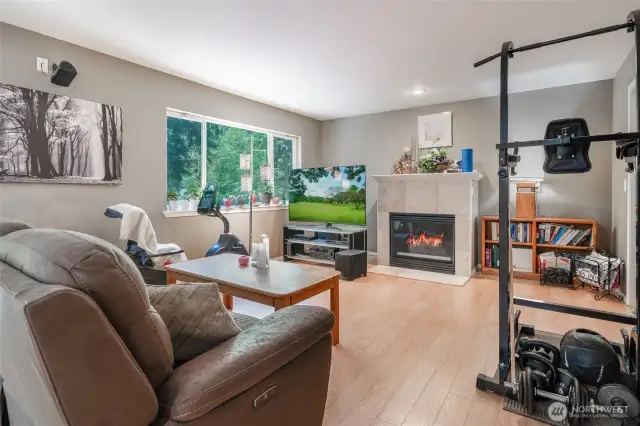 Den space with a gas fireplace for cozy evenings