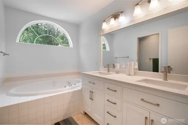 Master bathroom with a jetted tub/
