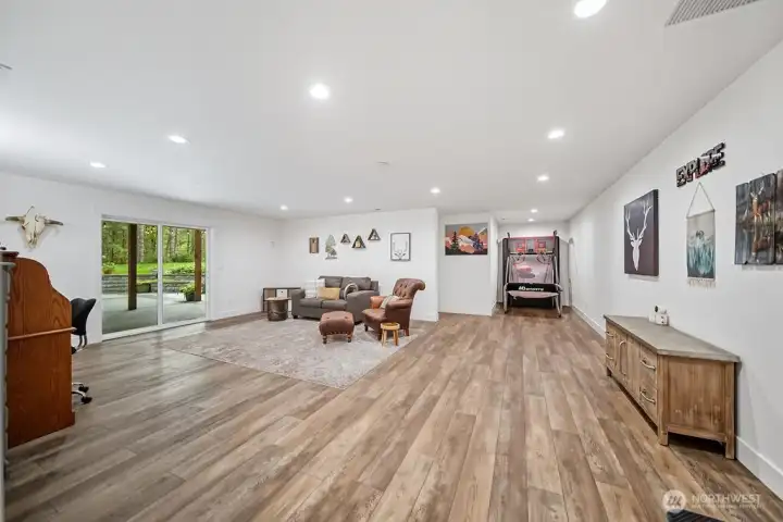This is a real flex room... a Game Room/ Rec room with theatre?  The lower level is on its own heating system and has a laundry room too.  The whole house is wired for internet and served by Astound.  The outbuildings are wired with CAT 6 for internet.  Re-circulating pump provides instant hot water thru-out both levels.