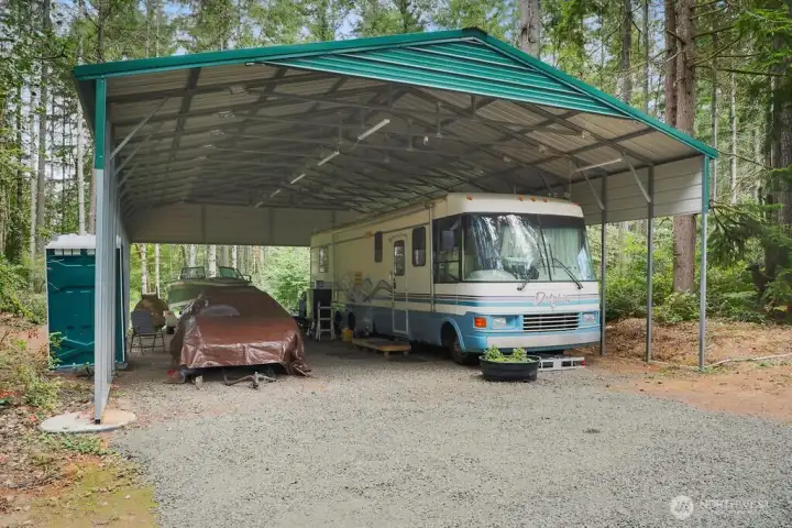 RV Carport with electrical and Water for up to 2 Rv's.   Measures 45' x 30' with 12' height. 90 AMP Remote sub panels operates the gate and RV carport.