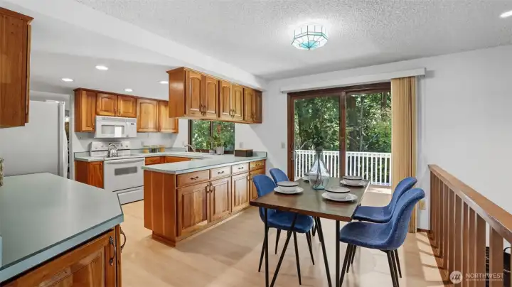 Enjoy meals with ease in this cozy dining space framed by natural views.
