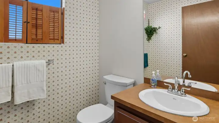 Convenient lower-level 1/2 bath for guests and everyday use.