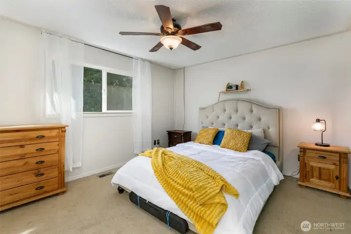 Primary suite with large closet and three-quarter bath.