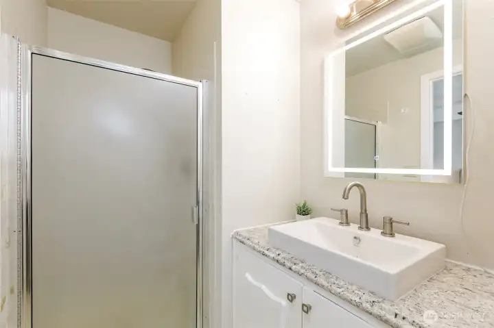 Primary bathroom with three-quarter bath.