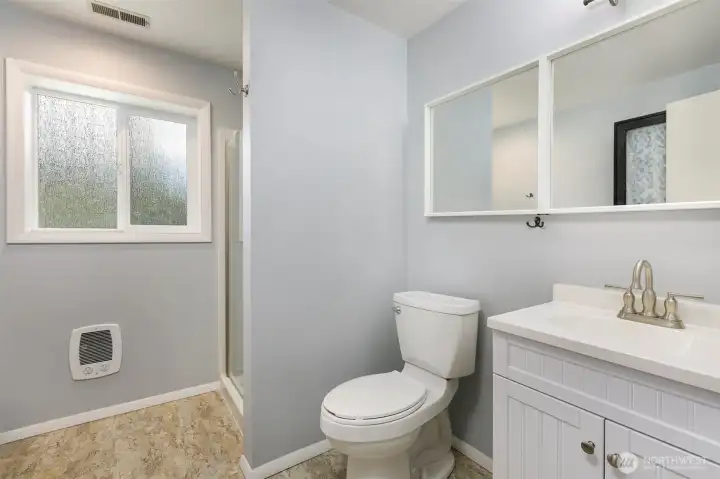 Lower, updated three-quarter bath.
