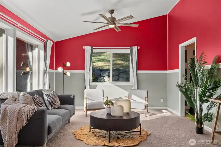 Living Room with large vibrant windows and vaulted ceilings
