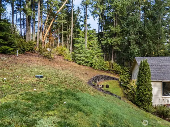 Lot extend beyond trees to the left.