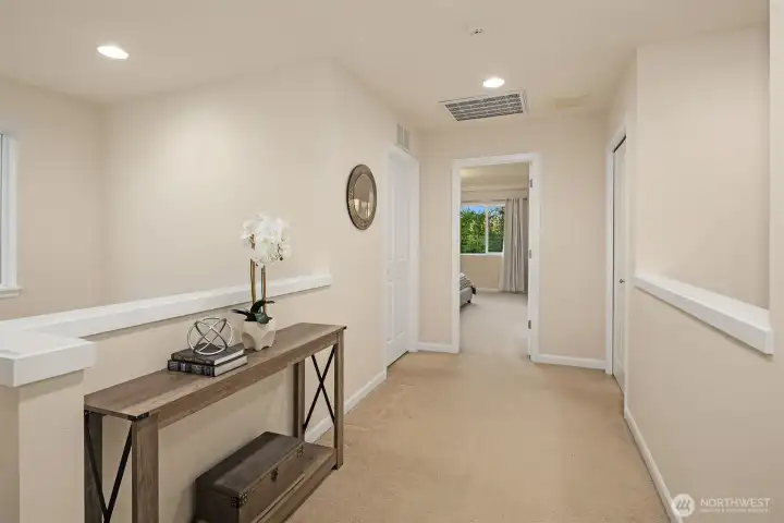 Upstairs hallway is extra wide and seller used as a study/game area - there is room for a desk or shelving.