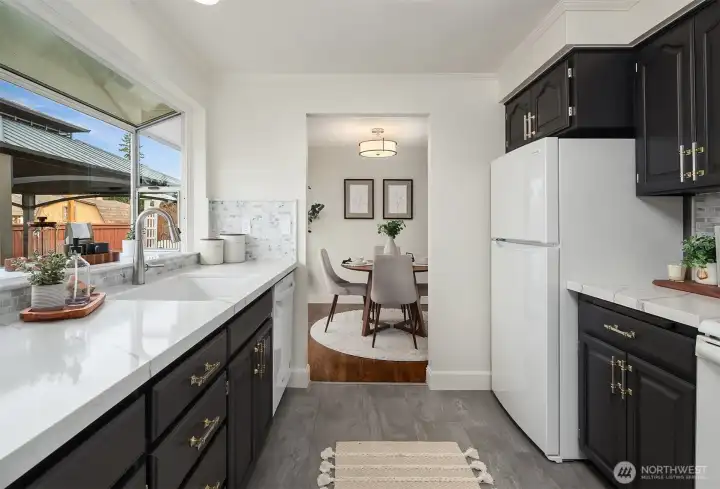 Kitchen flowing seamlessly into dining area.