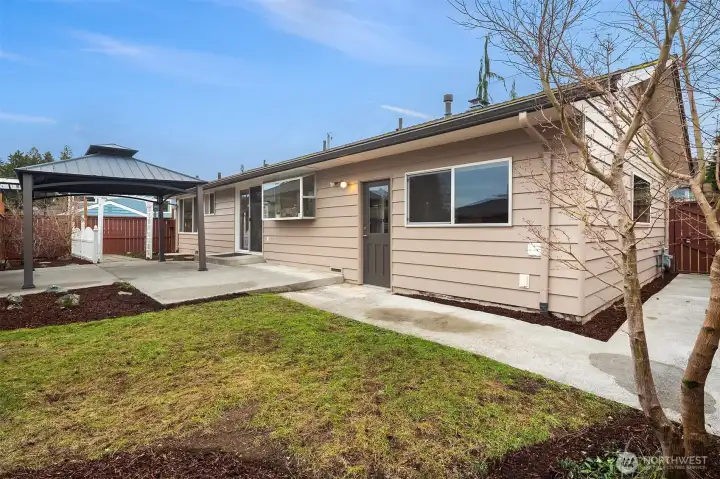 Back patio with access to garage.