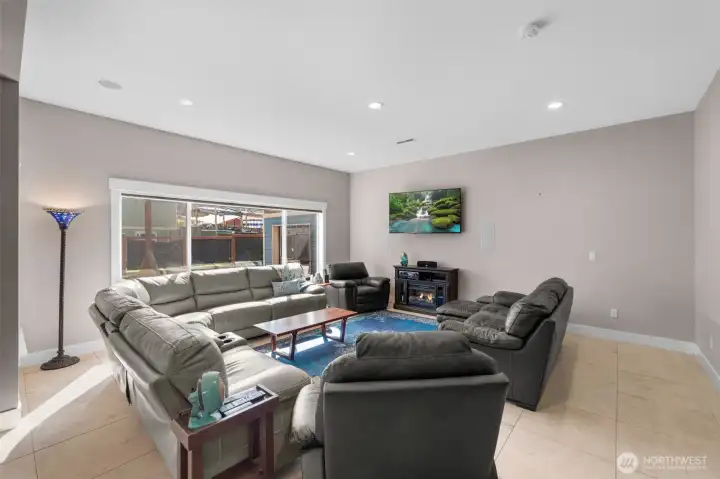 Comfortable main-level living space with abundant natural light and an open feel. Built in surround sound speakers convey with the home.