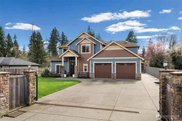 Entirely fenced with huge three car garage.
