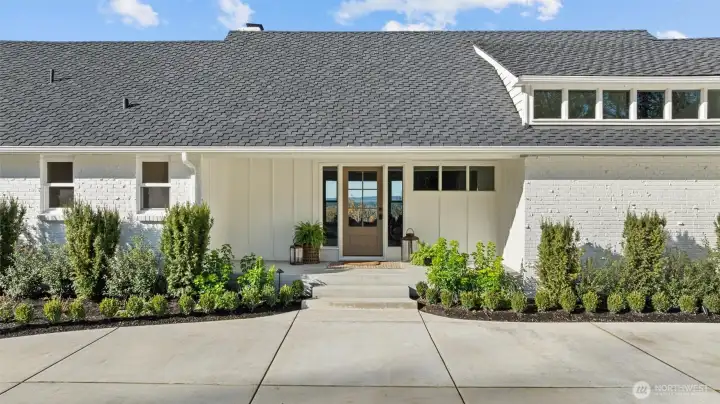 50-year Presidential roof, new windows, solid wood door and custom board and batten detail.