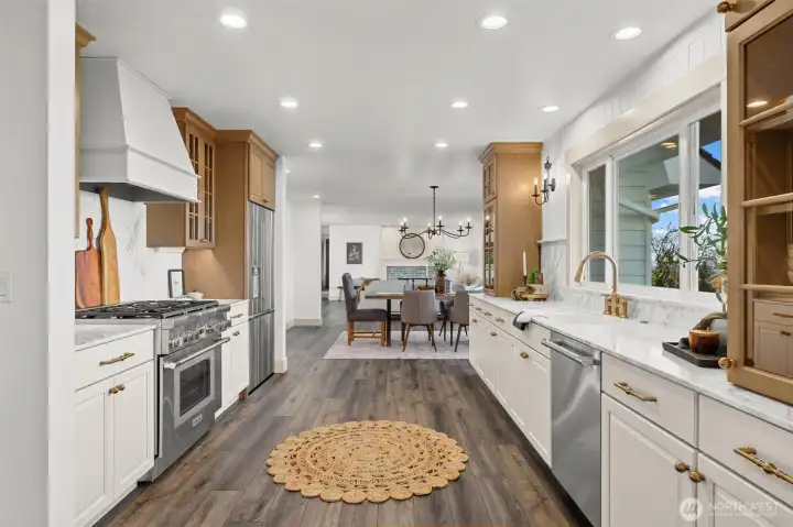 Amazing chef's kitchen, perfect for entertaining family and friends. Custom sideboard by entry (stays with home) was designed to be multifunctional and can be used as a moveable island, if desired.