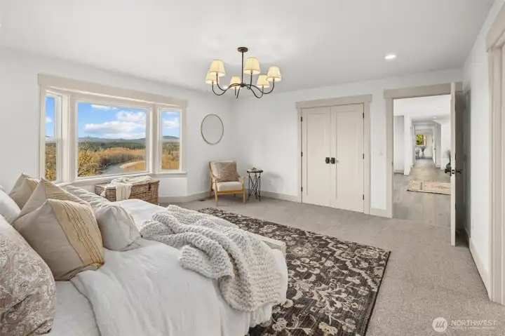 Main floor primary suite with stunning views of the mountains and river!
