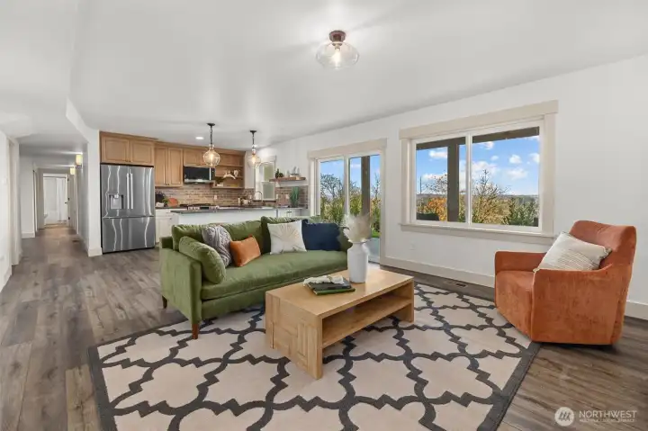 Amazing lower-level features full kitchen with bar seating, family room with custom fireplace, 2 large guest bedrooms, full size bath and utility room! Could easily be a MIL for multigenerational living!