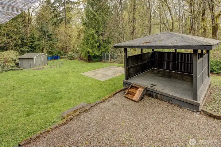 Step outside to your own private oasis. The large, flat backyard offers endless possibilities, complete with a charming gazebo, garden beds for growing your own vegetables.