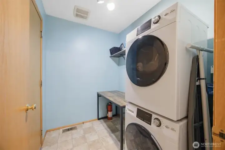 Laundry room with entrance to garage