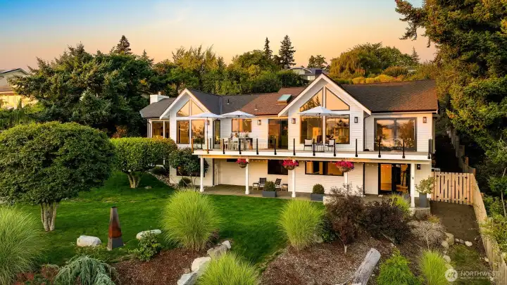 Nestled in the exclusive Edgemoor neighborhood, this stunning home sits on nearly an acre of pristine, landscaped grounds, offering both space and privacy in a highly sought-after location.