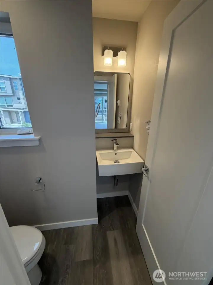 Photo of subject property. Powder room off of kitchen