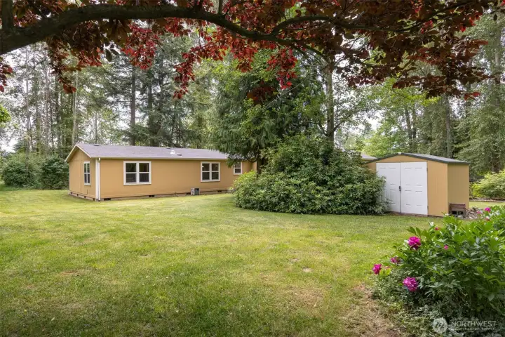 Large and flat grass area surrounding the home. Large and flat grass area surrounding the home.