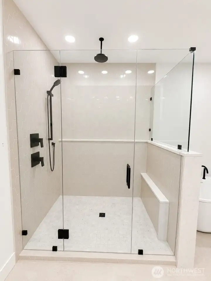 Primary Shower with custom ledges and rain head