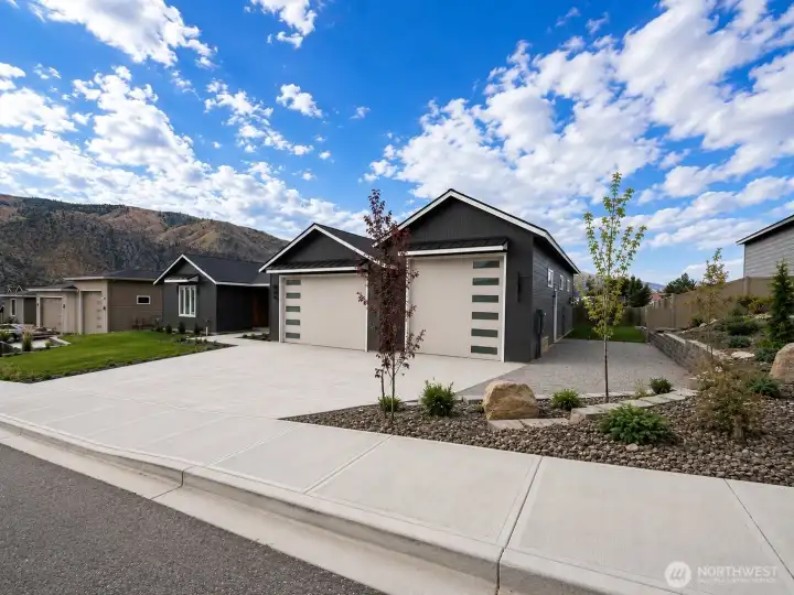 Exterior of home with RV parking along 60' RV garage bay