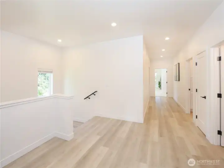 Spacious landing and hallway with plenty of natural light