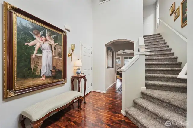 Garage entryway to the left, Downstairs 1/2 bath behind the photographer