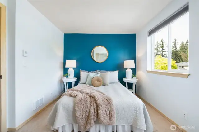 Primary bedroom, which offers plenty of natural light.