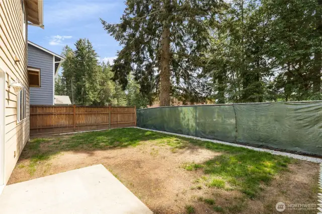 Fenced-in backyard. In a family-friendly neighborhood,