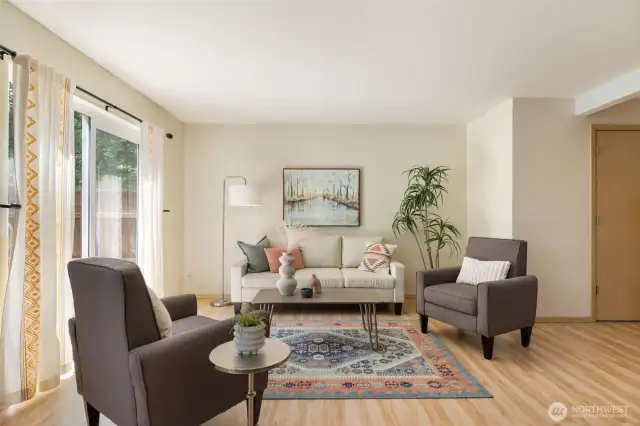 The spacious living room provides easy access to the backyard.
