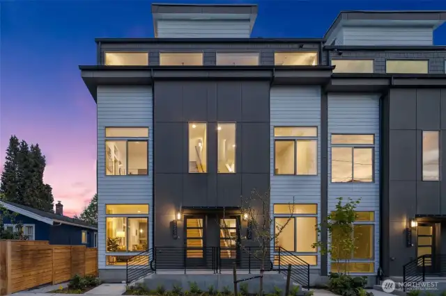 Welcome to the Arlo Community in Wallingford by Greencity Homes! This home has a twilight curb appeal with a modern flair—clean lines, expansive windows, and striking contrast come alive at dusk. It makes an unforgettable first impression.