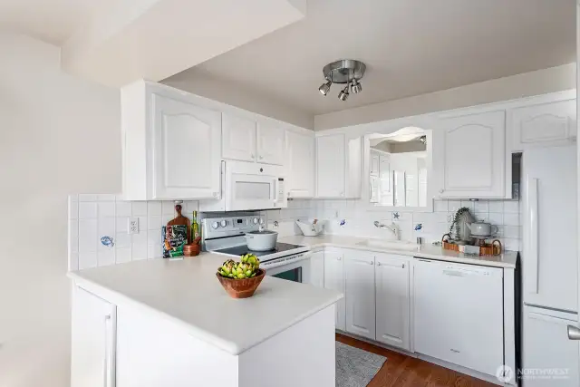 This light-filled, updated kitchen boasts plenty of storage solutions and a spacious pantry, making meal prep a breeze.