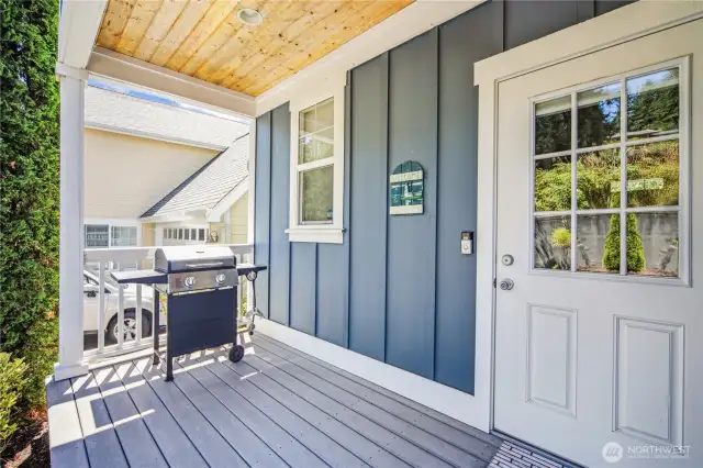 Covered back porch ~ large enough for a BBQ and seating.