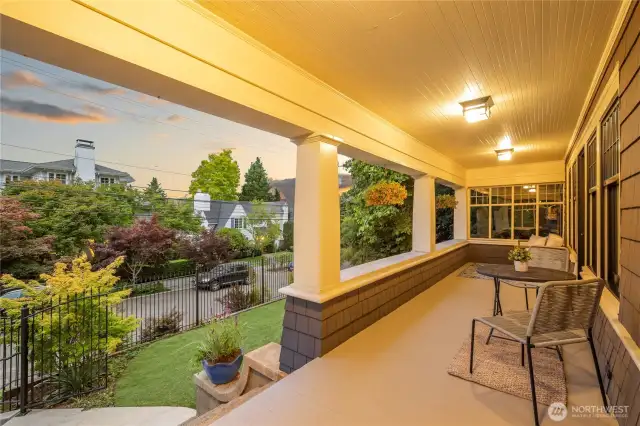Expansive front porch to watch sunsets and the neighborhood happenings, overlooking front yard.
