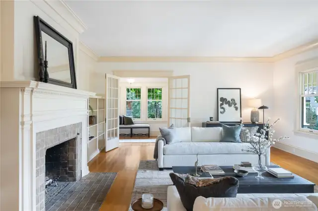 Living room with wood fireplace and wall of built-in's