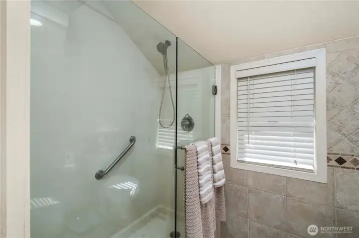 The walk in shower in the primary bath.