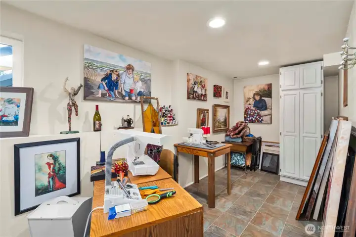 This room is filled with light from the waterfront side of the property.  There is a separate door to the back yard just behind.