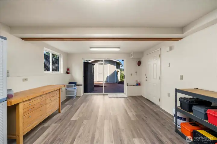 The shop has direct access to the outdoors and the family room on the lower level.
