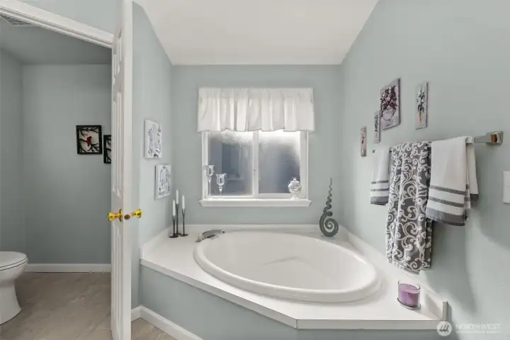 Relax and unwind in the large corner soaking tub.