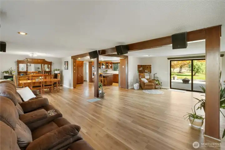 Spacious living room with a cozy wood burning stove.