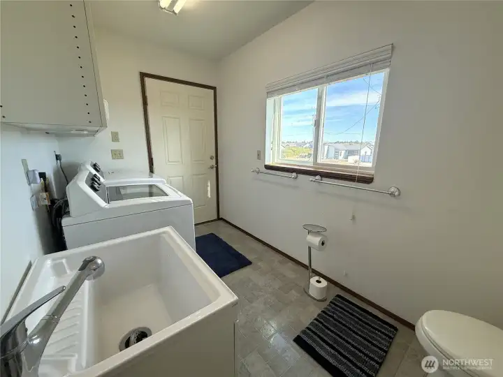Full bath with laundry and 2nd sink  and access to back