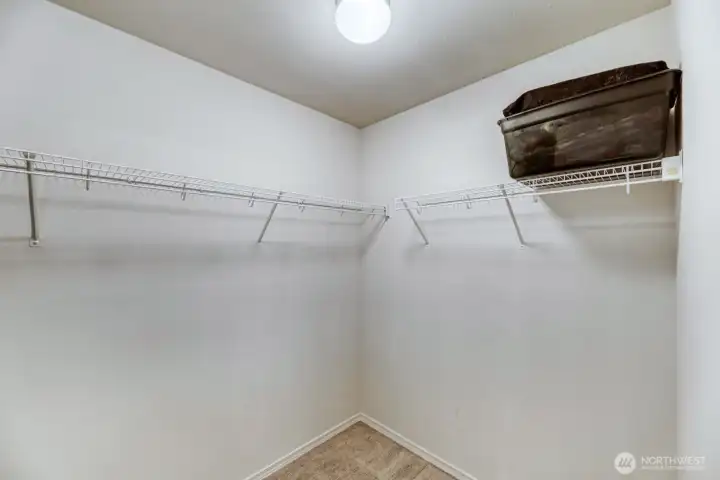 Primary bedroom walk-in closet
