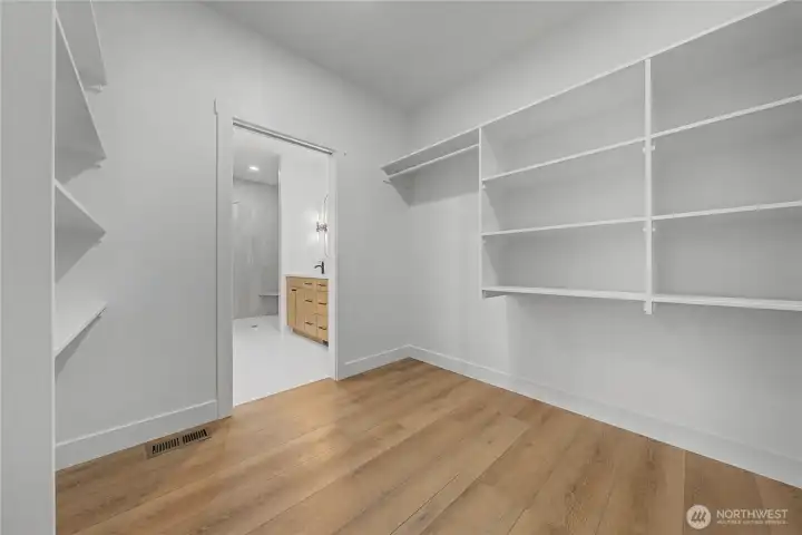 Primary bedroom walk-in closet